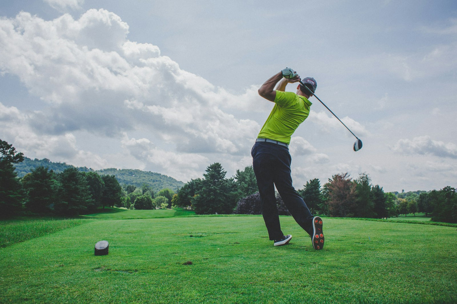 Golfer on an open fairway in morning light